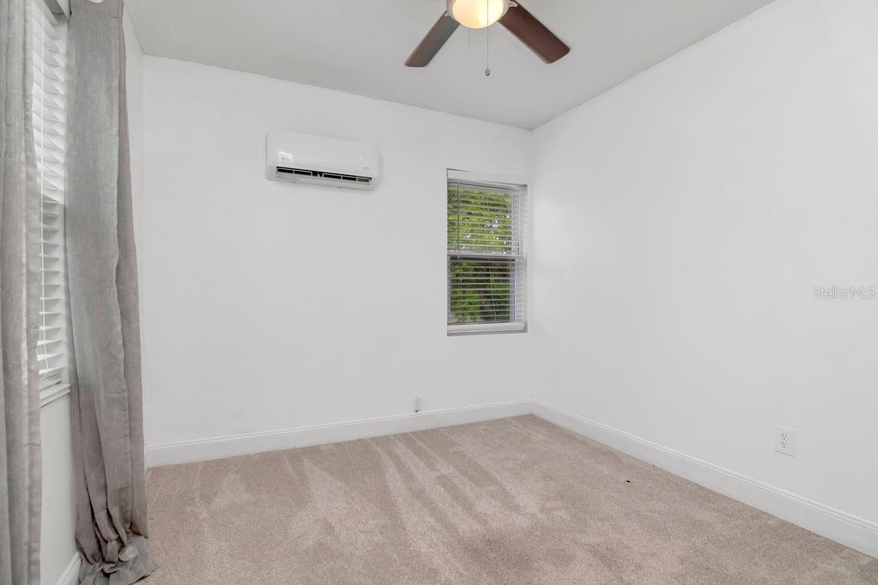 Bedroom #3 Upstairs with Mini-Split, Ceiling Fan, Built In Closet, and New Carpet Installed 04/08/26.