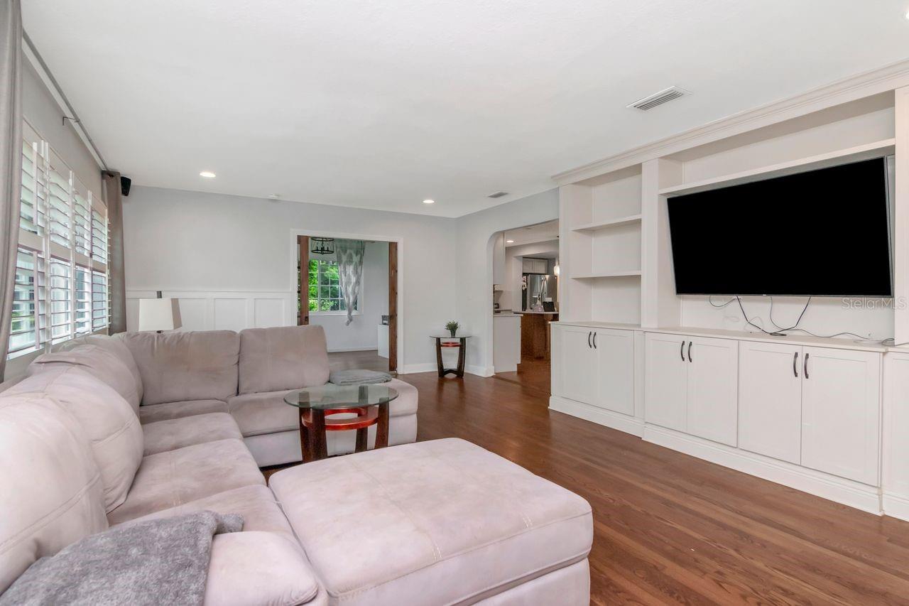 Living Room with Entry to SunRoom through Pocket Doors and Kitchen