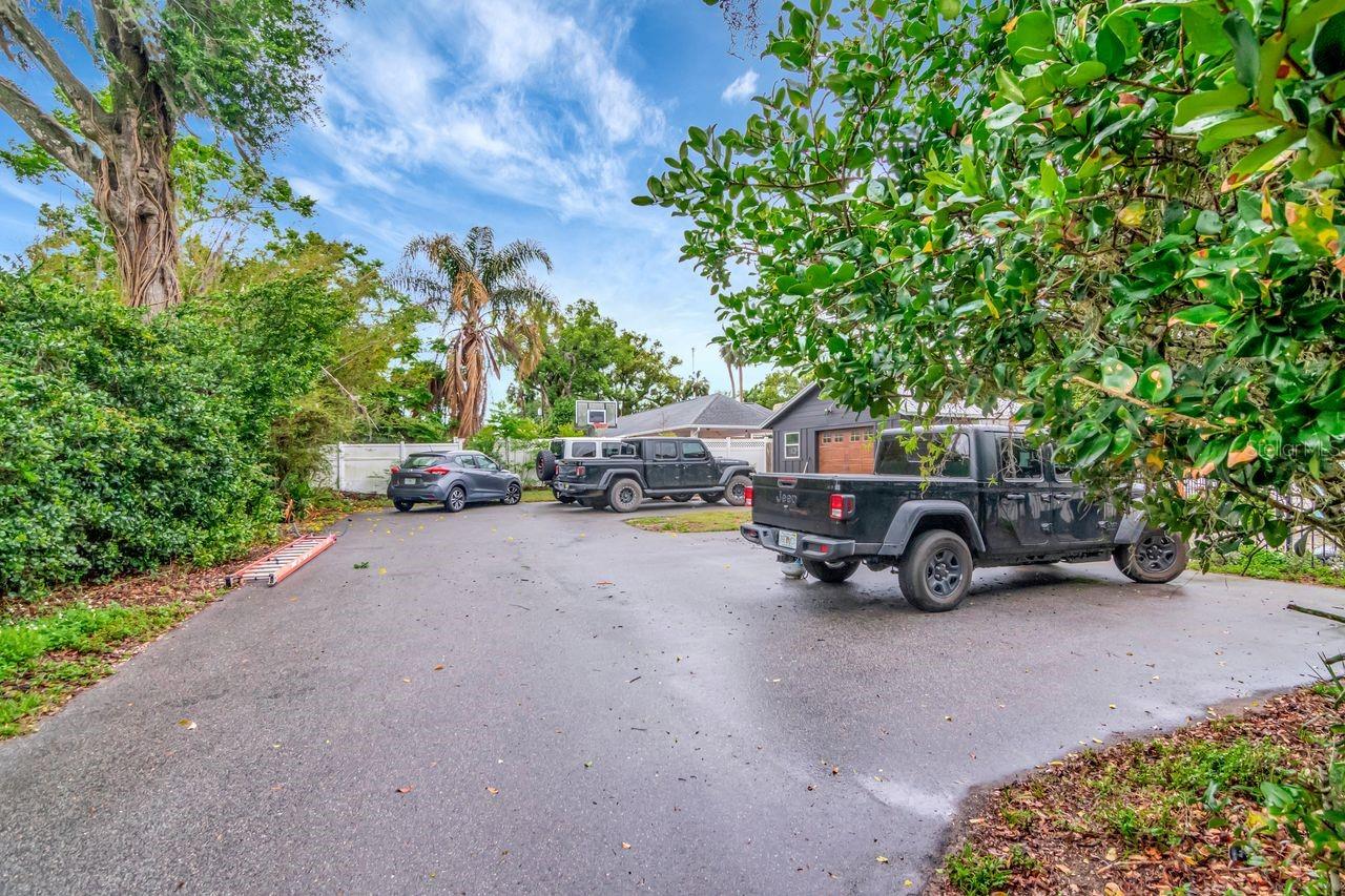 Expansive Side Driveway, Side Car Garage Entry, Entry to Home through Courtyard and Breezeway.