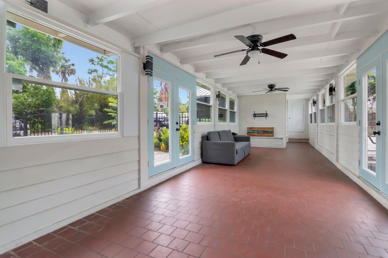 Custom Built Breezeway with 3 Entryways from Kitchen, Courtyard, and Poolside. Breezeway has decorative planter, Storage Closet and Access to the Garage/Workshop.