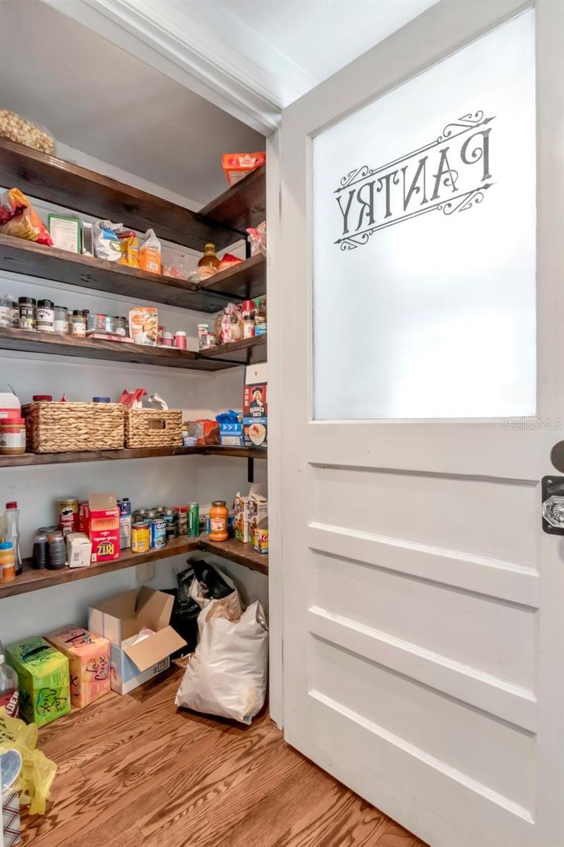 Custom Decorative Pantry Door and shelving for large Pantry Closet.