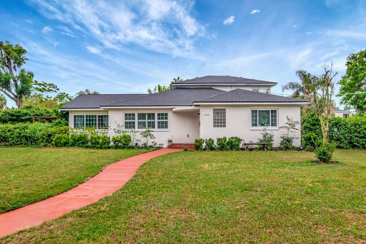 Front of Home and Walkway to Steps and Front Door with Covered Entry.