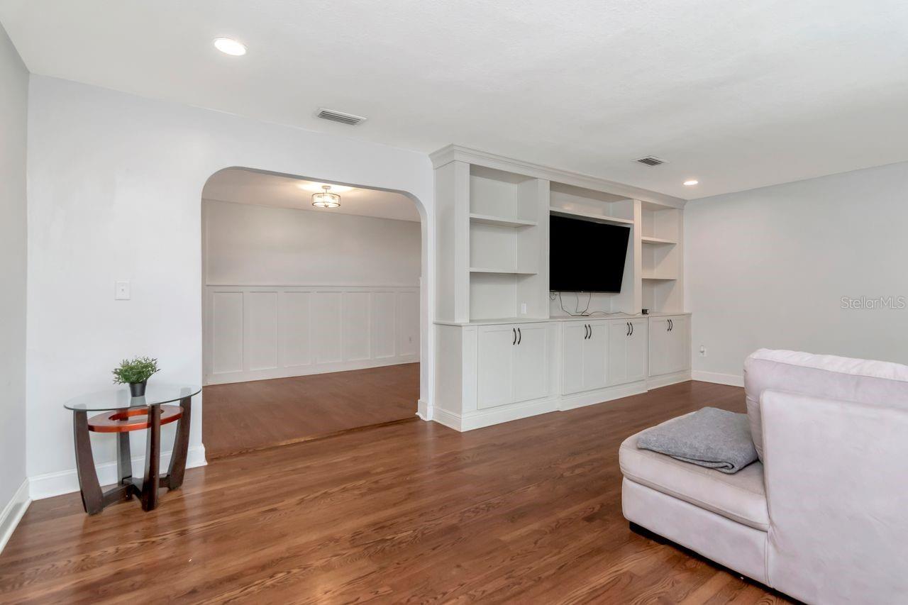 Living Room and Arched Entry to Formal Dining Room and Kitchen