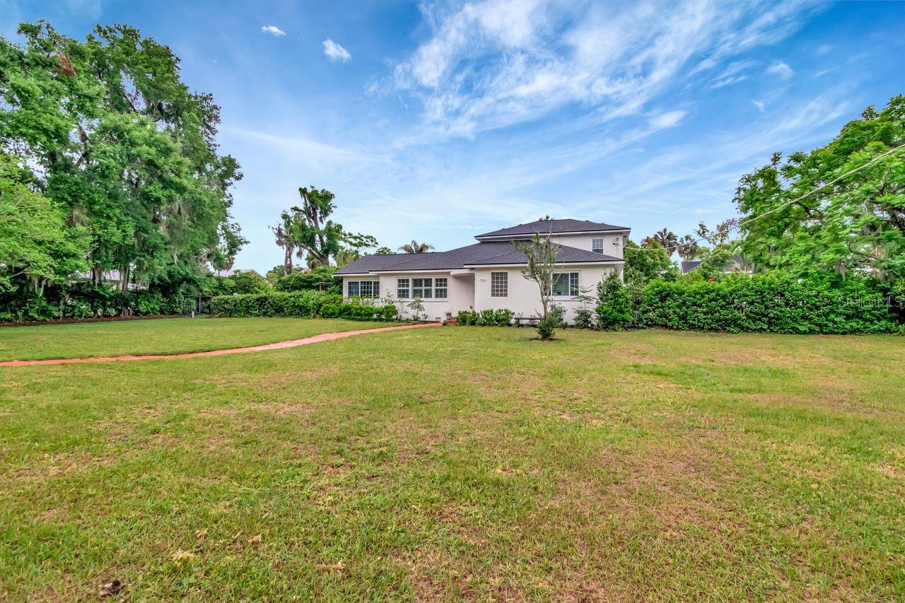 Oversized Lot - Expansive Front Yard - Beautiful Walkway to Entrance of the Home.