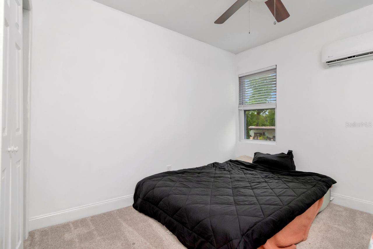 Bedroom #4 with Mini-Split, Ceiling Fan, Built In Closet, and New Carpet Installed 04/08/26.