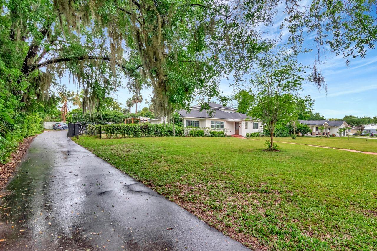 Driveway from Road to Additional Gated Large Side Driveway and Side Car Entry Garage and Additional Entrance to the Home through Breezeway
