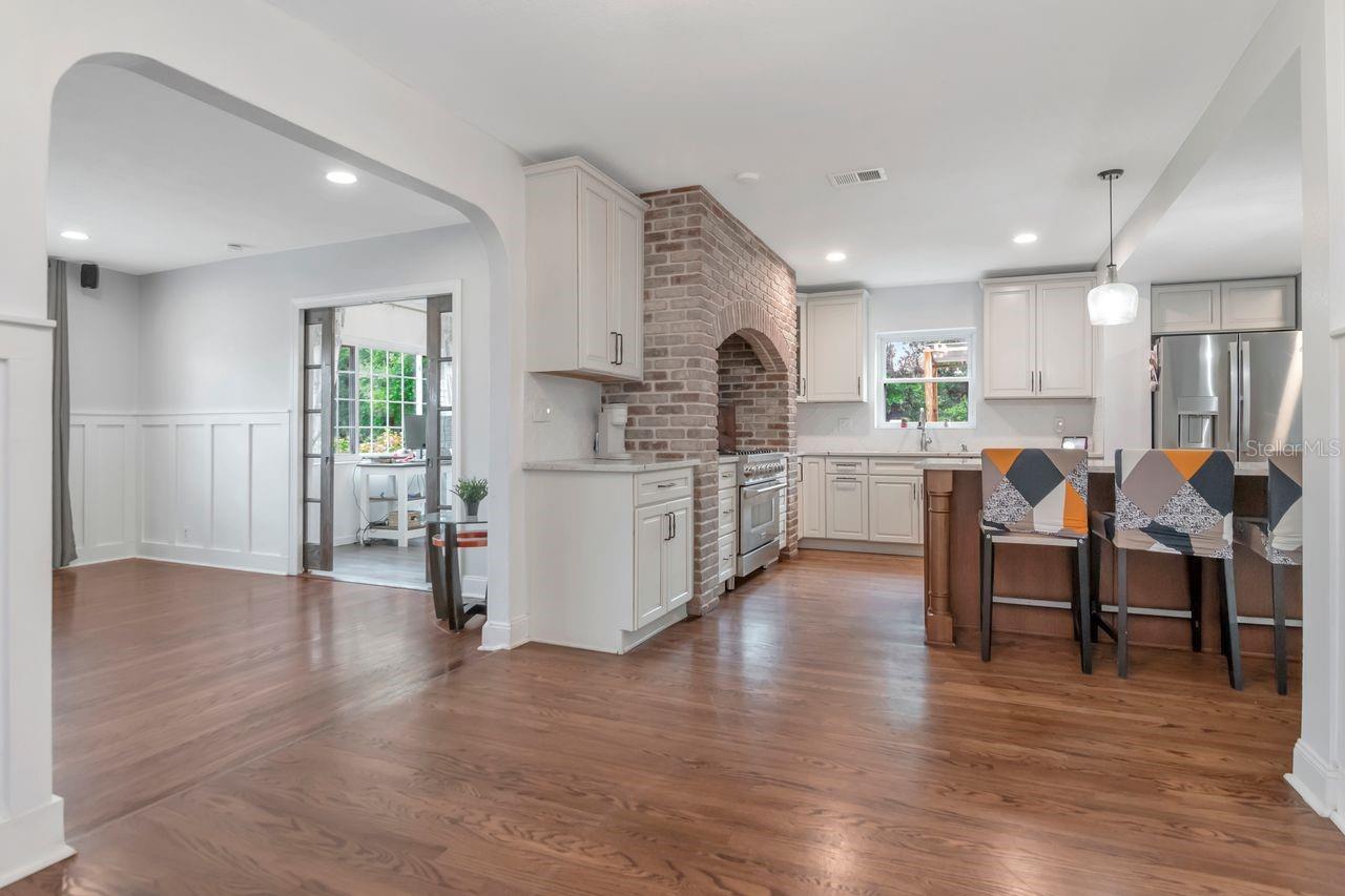View from Formal Dining room to Living, Flex Space, and Kitchen