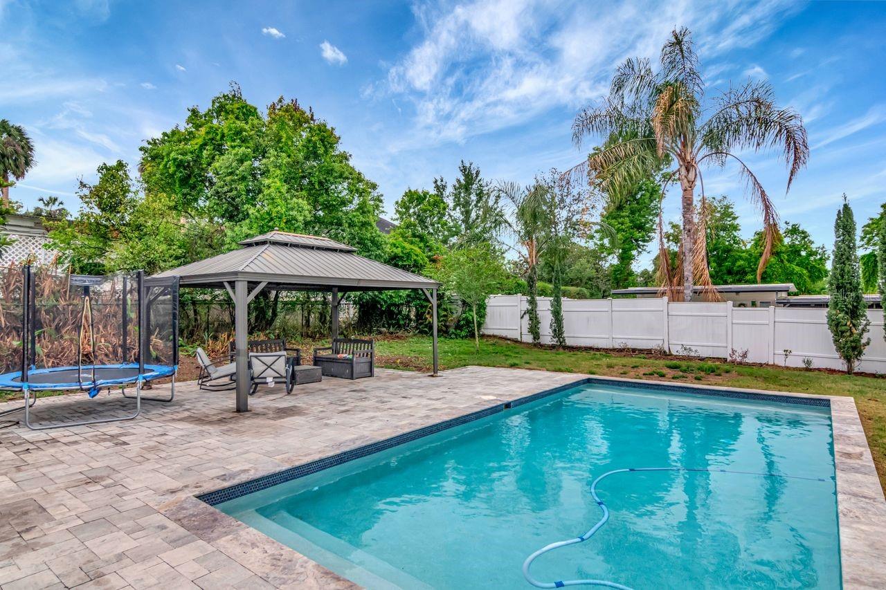 Custom Heated Salt Pool with Pavered Deck and Gazebo.