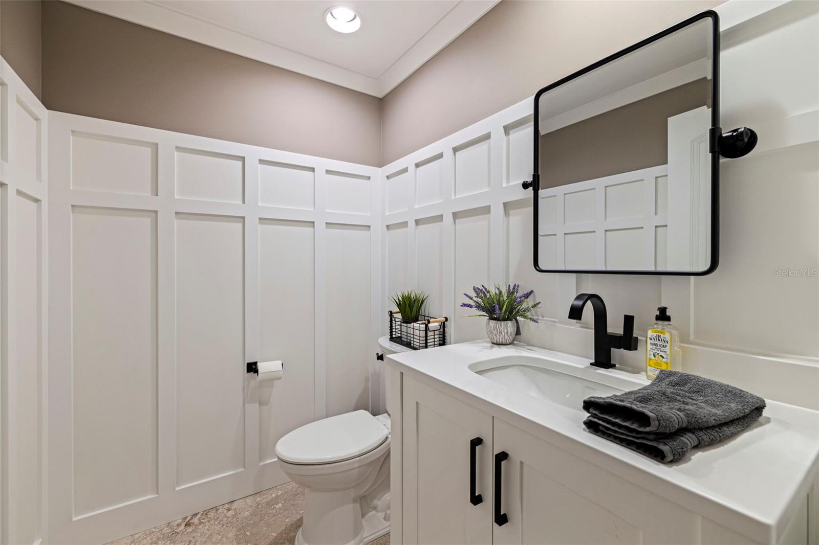 Stylish half bathroom with modern vanity and clean finishes