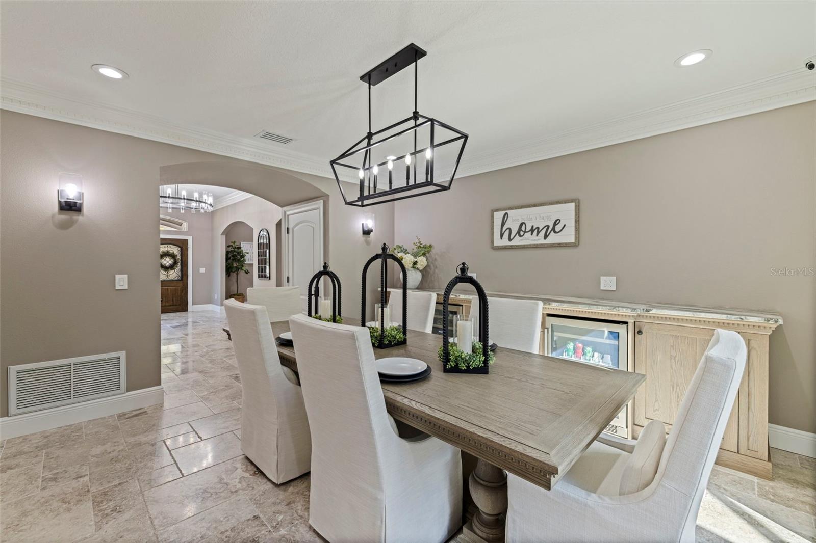 Elegant dining space with modern lighting, and tons of natural light.