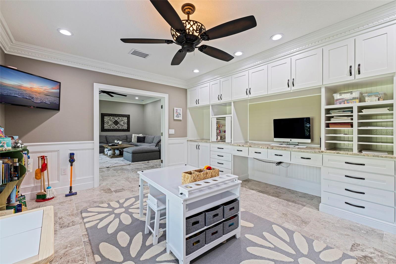 Private office with custom built-in cabinetry, offering a functional and stylish workspace