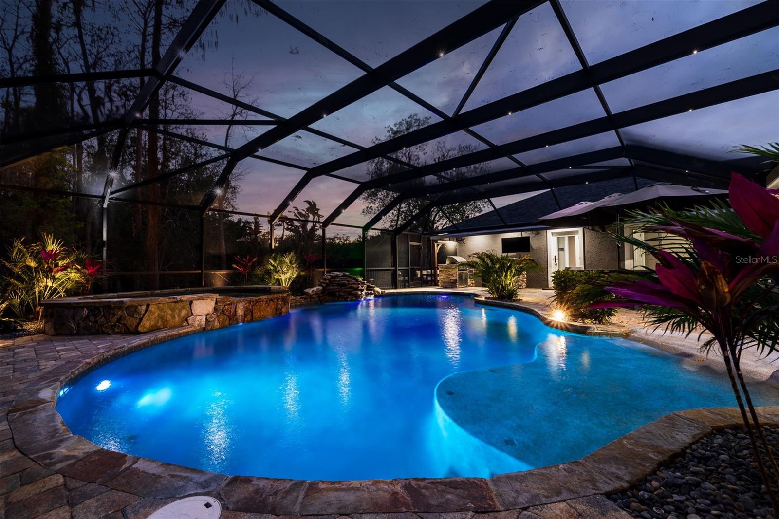 Pool area at dusk showcasing tranquil ambiance and lighting