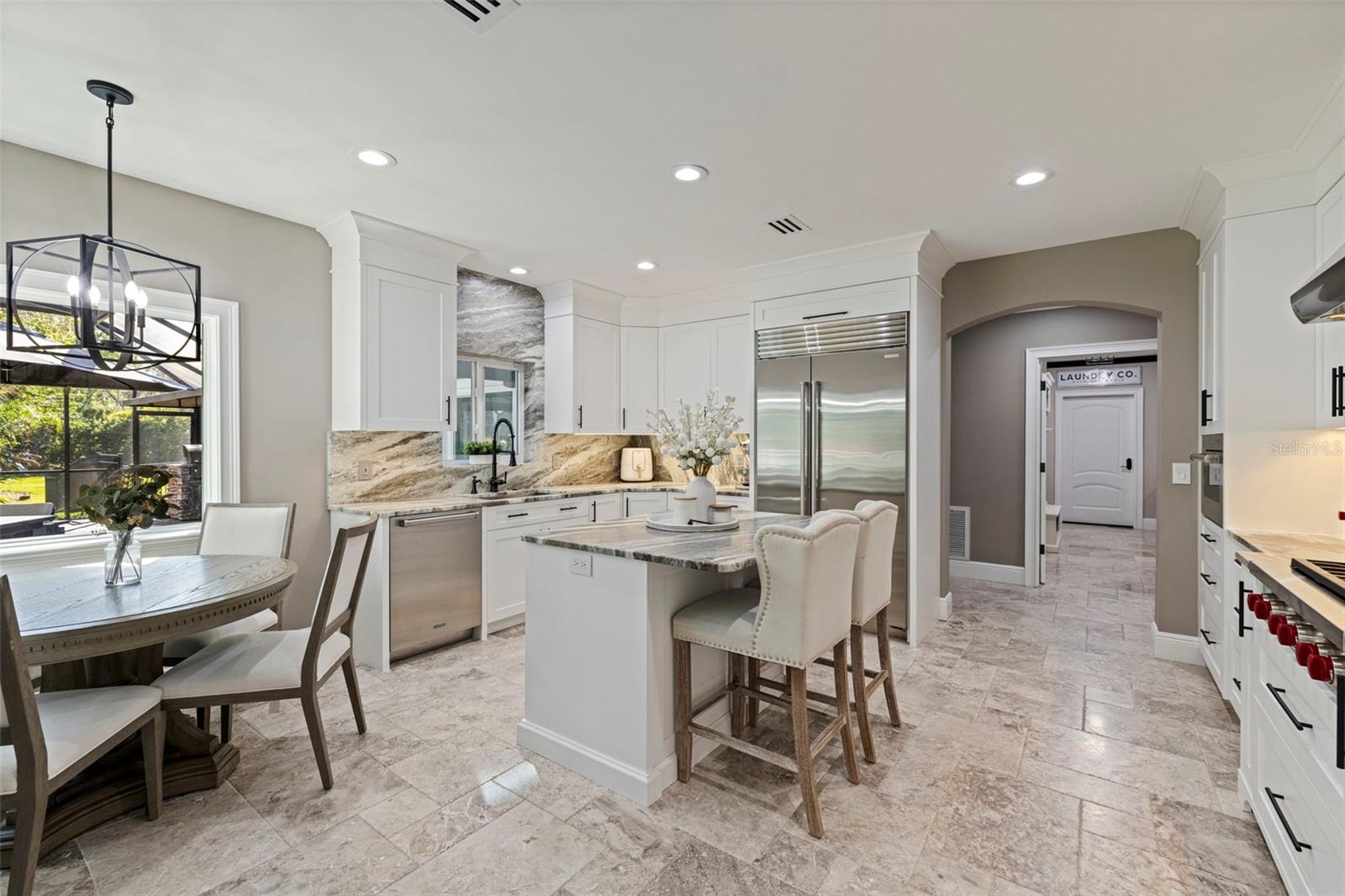 Spacious open-concept Kitchen with eat in area area with tons of  natural light