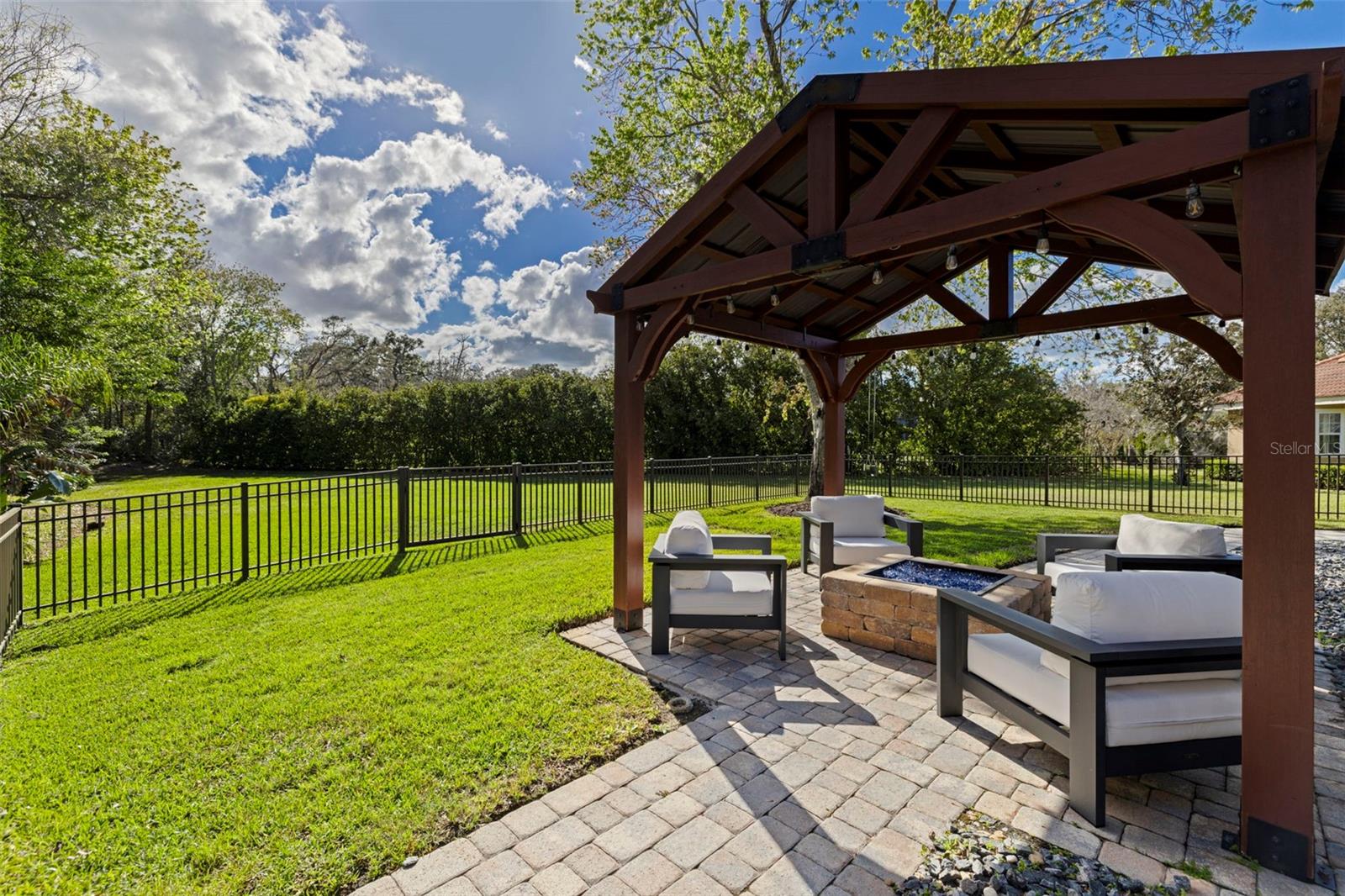Outdoor seating area with pergola, perfect for relaxing or entertaining