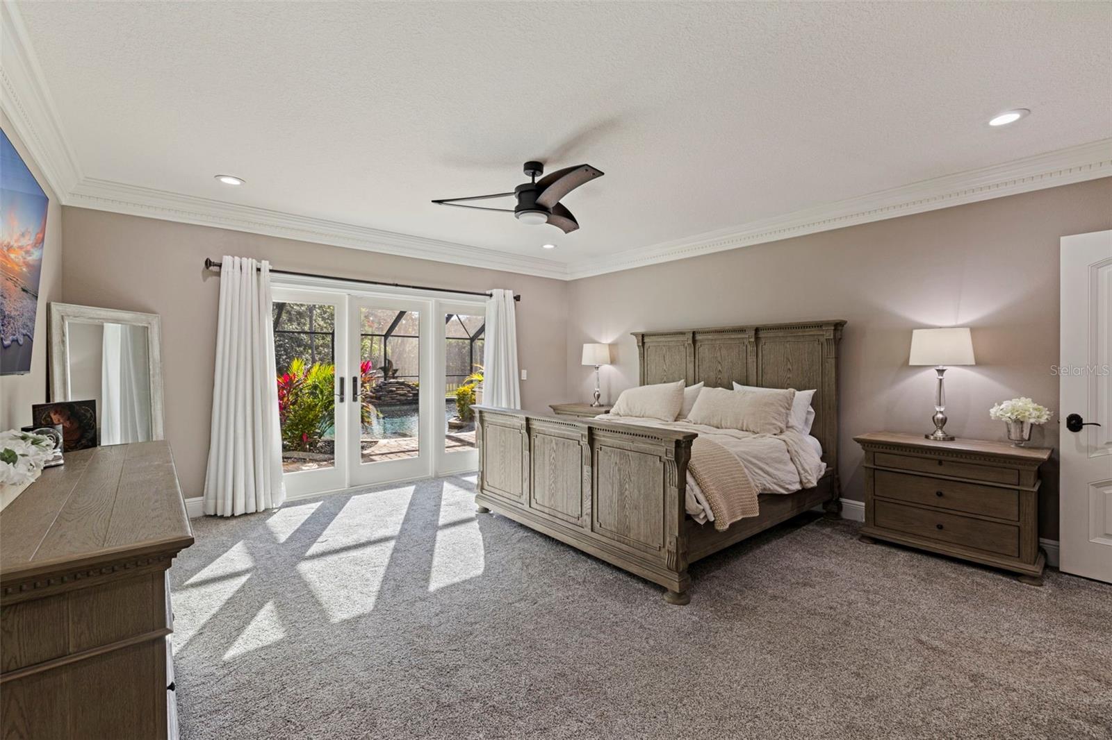 Spacious Primary  bedroom with natural light and neutral tones