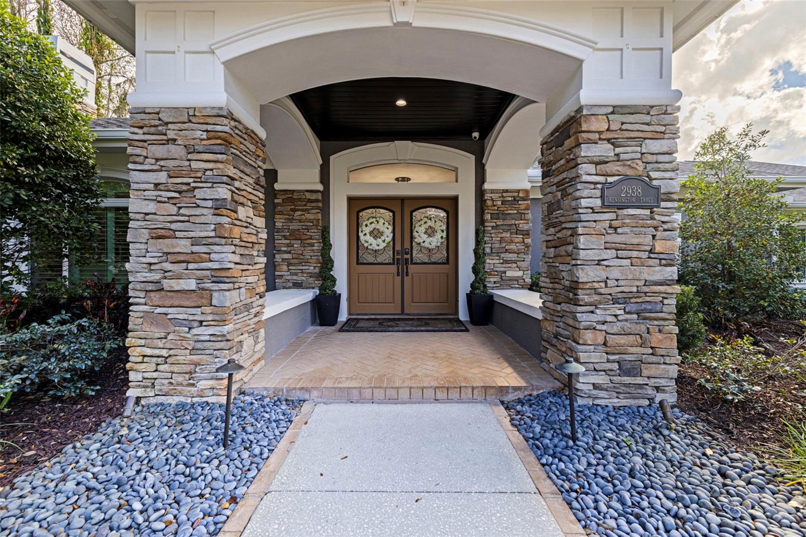 Grand front entry with stone accents and welcoming double doors