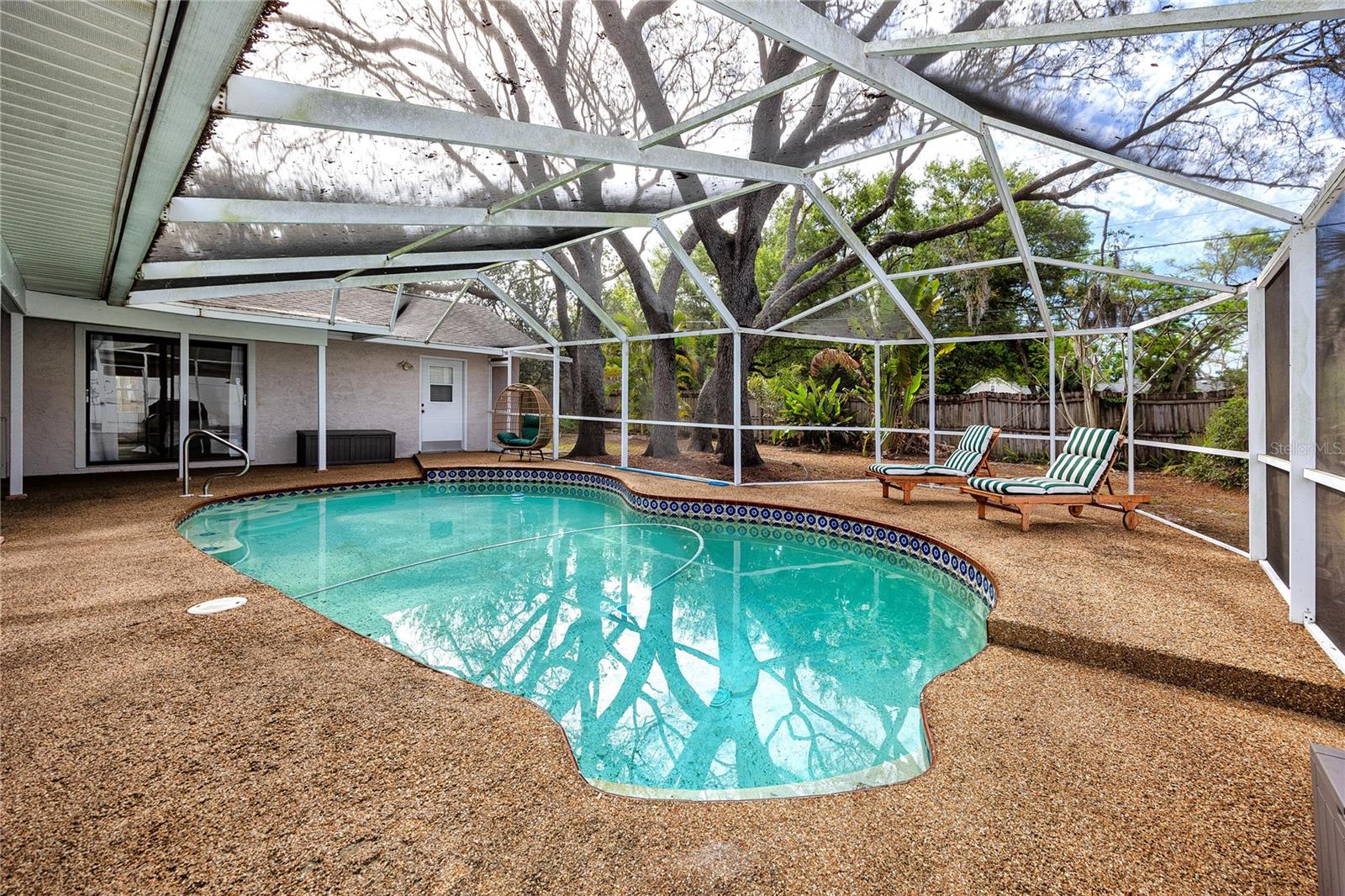 Full pool with caged lanai.