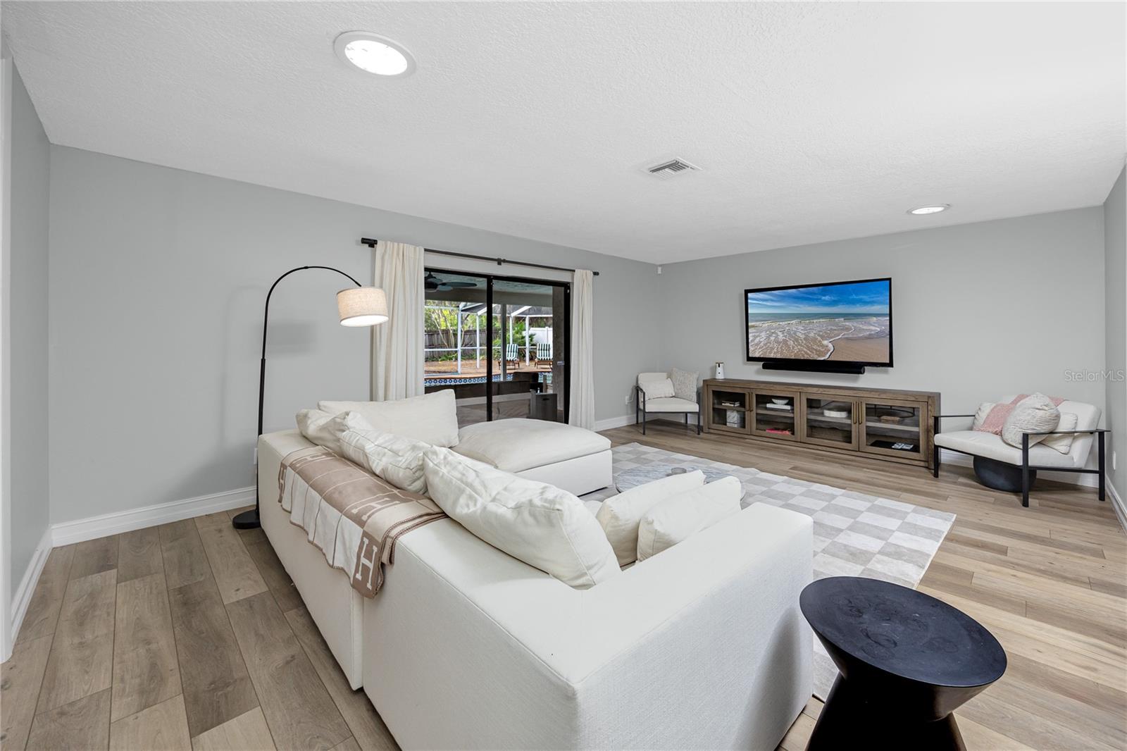 Large living room with access to the lanai.