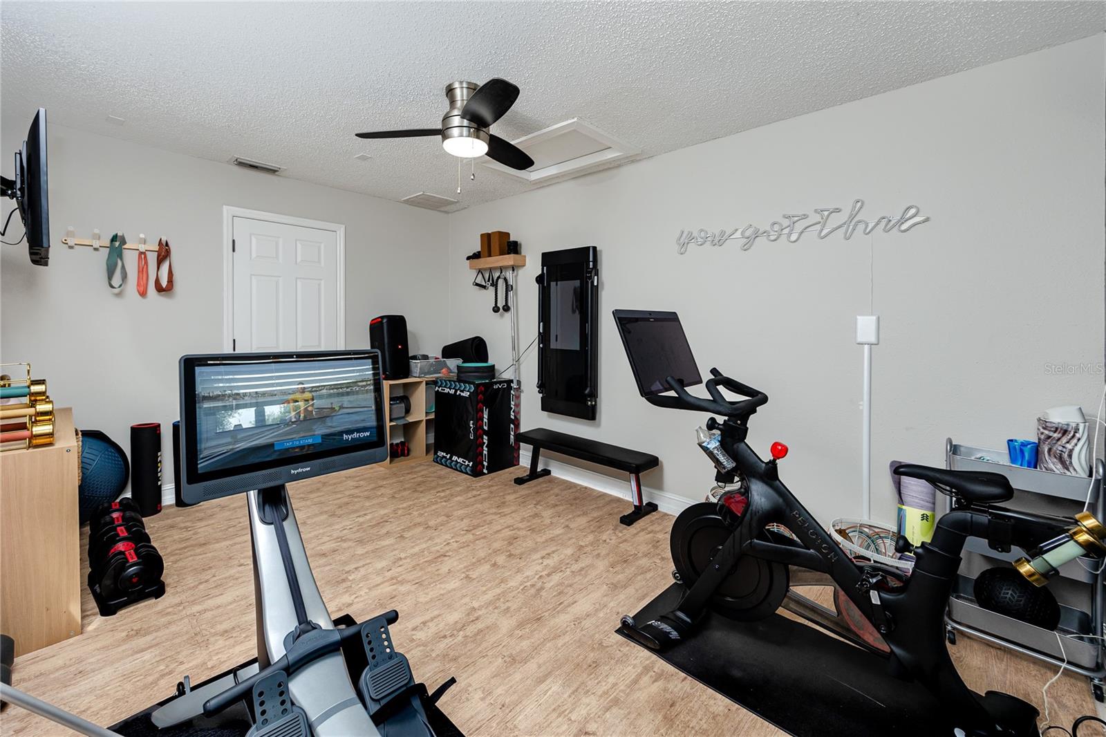 Bonus room off the pool currently used as a gym, but has lots of possibilities.