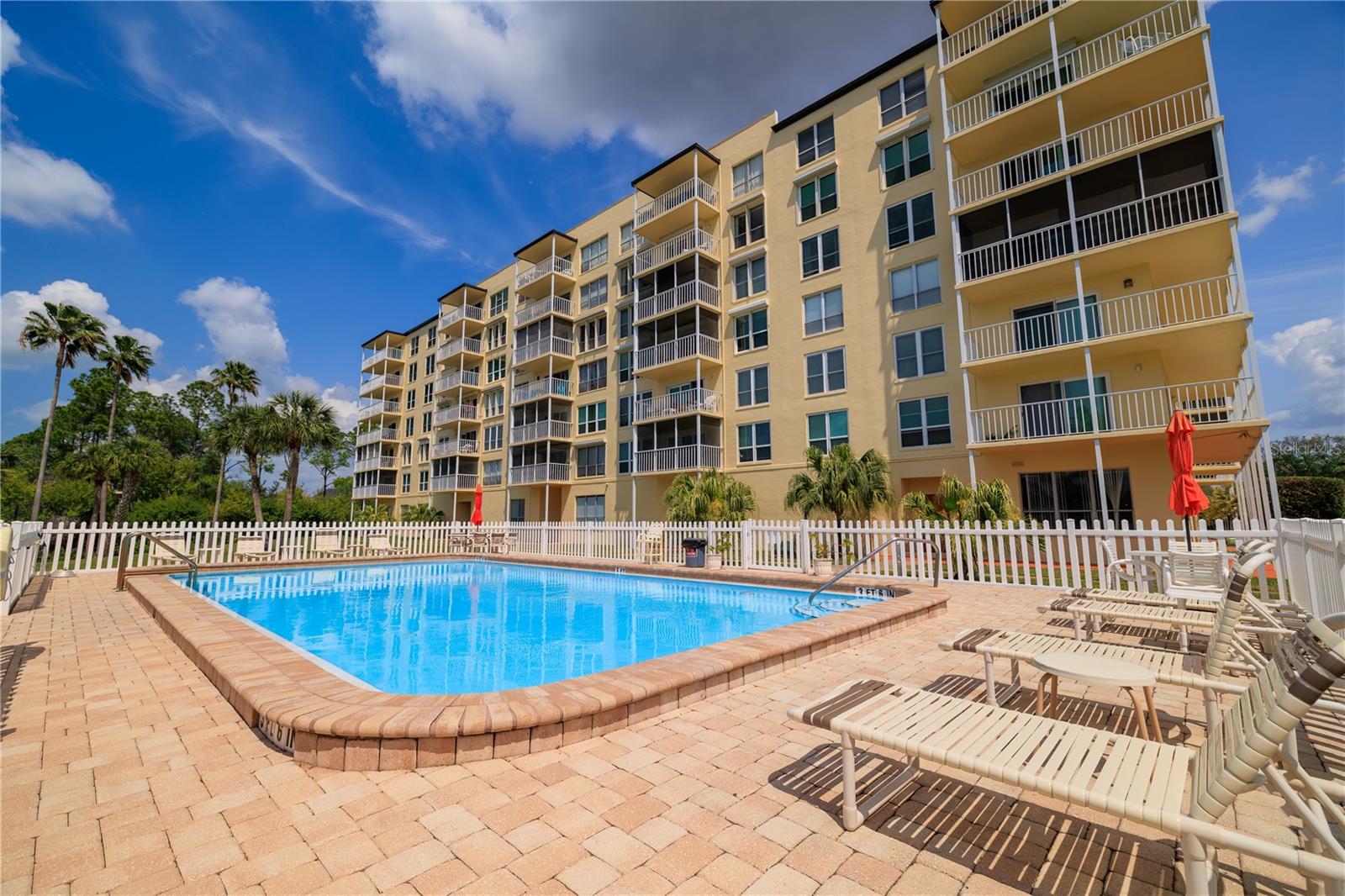 Sparkling heated pool and paver sundeck offers plenty of seating to soak up the rays.