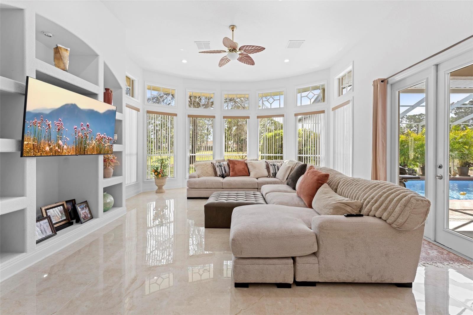 Family Room with Bow Window, French Doors and Built-Ins