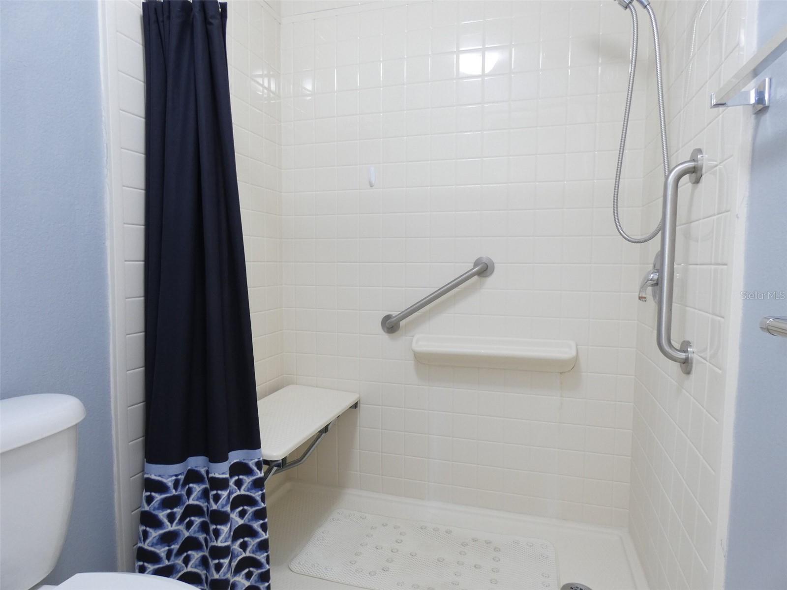 guest bath with built in shower chair