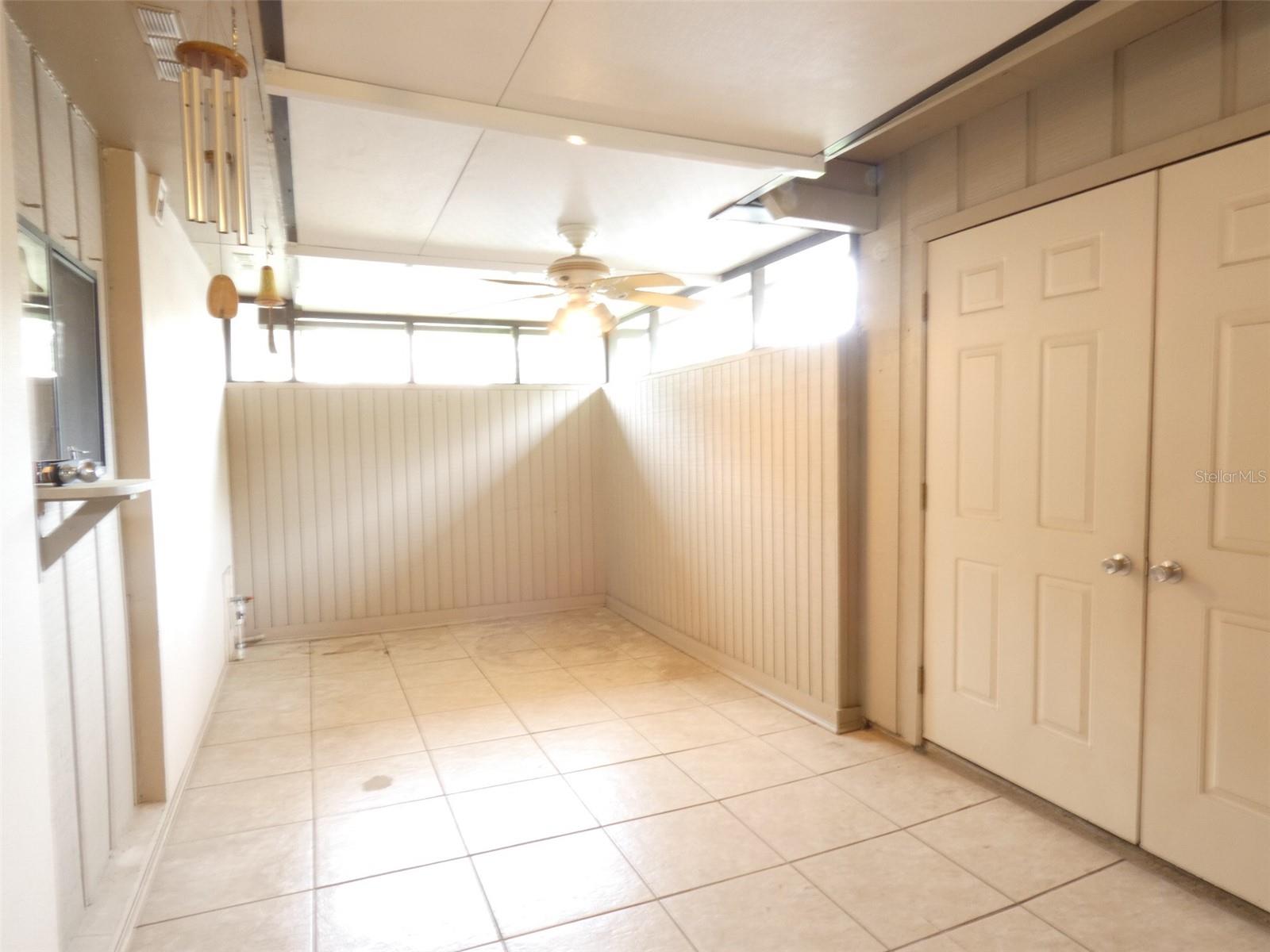 back screened lanai/patio with pass through window to kitchen