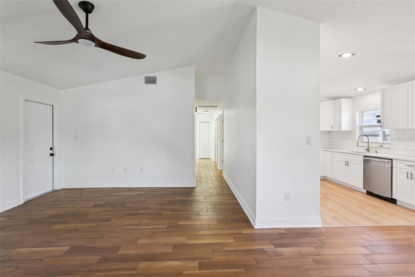 Split view of living room and kitchen of main house