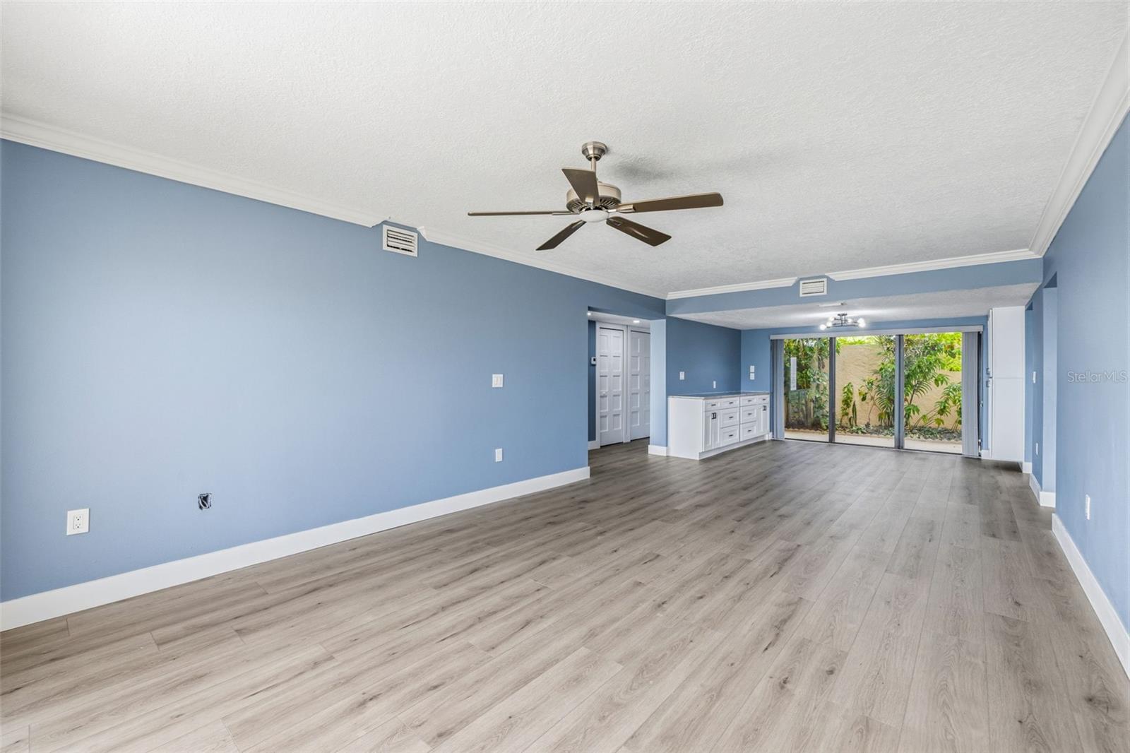 View of Great Room with dining and view of Front patio