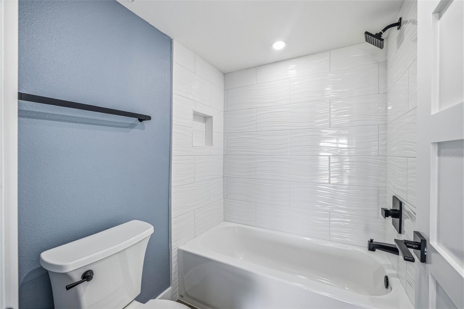 Primary bathroom with tub and shower