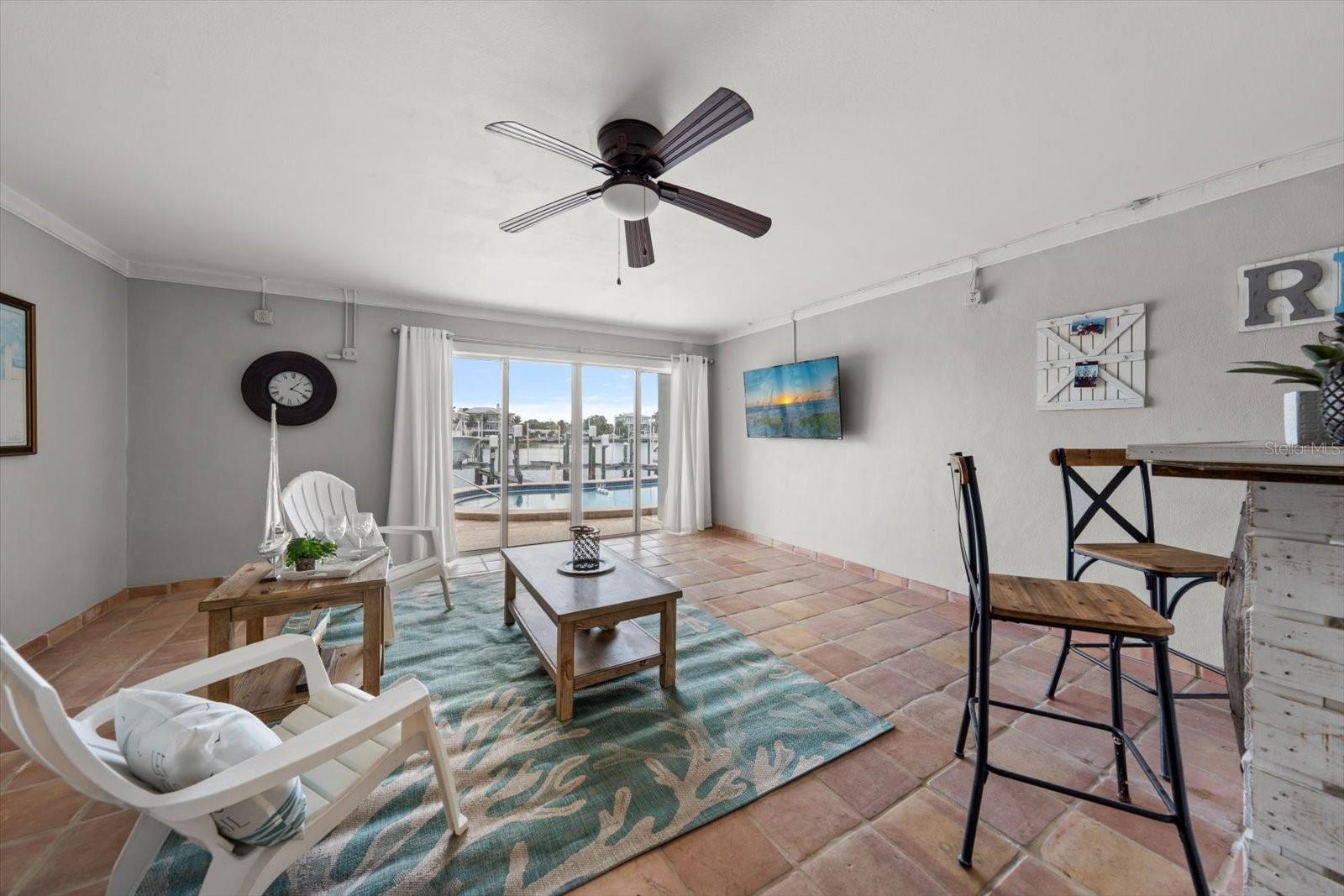 Quickly access the pool and deck area from this fantastic ground-level bonus room!