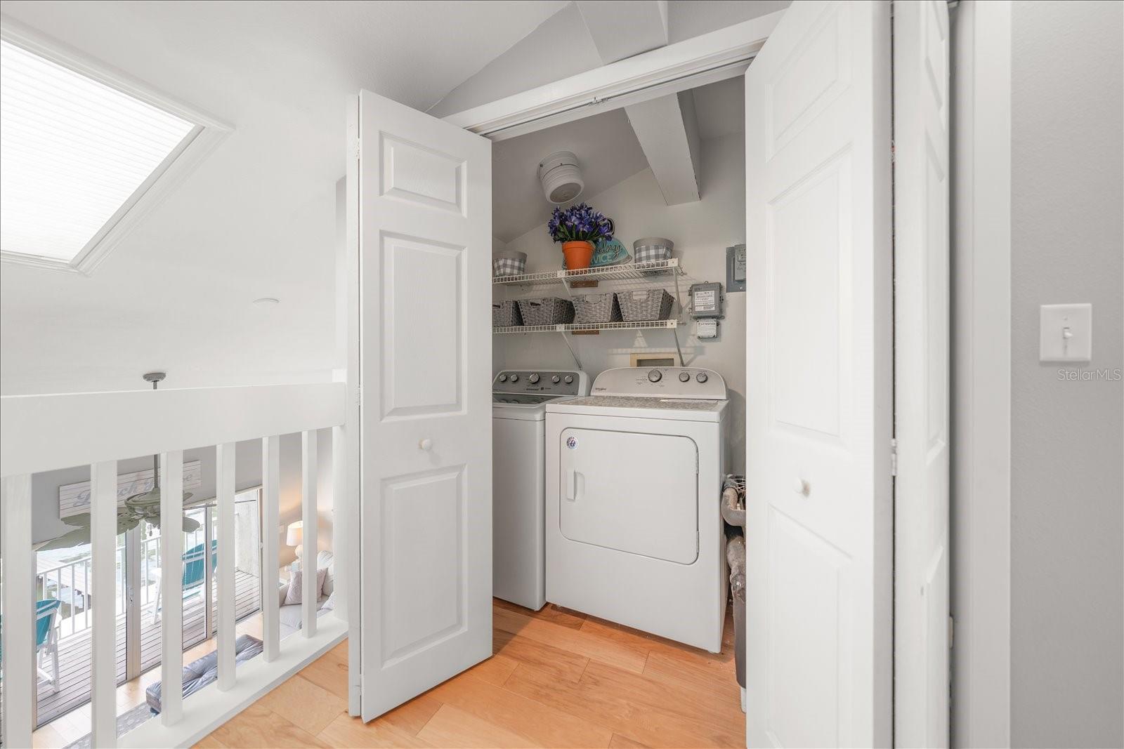 Convenient laundry closet near the primary bedroom.