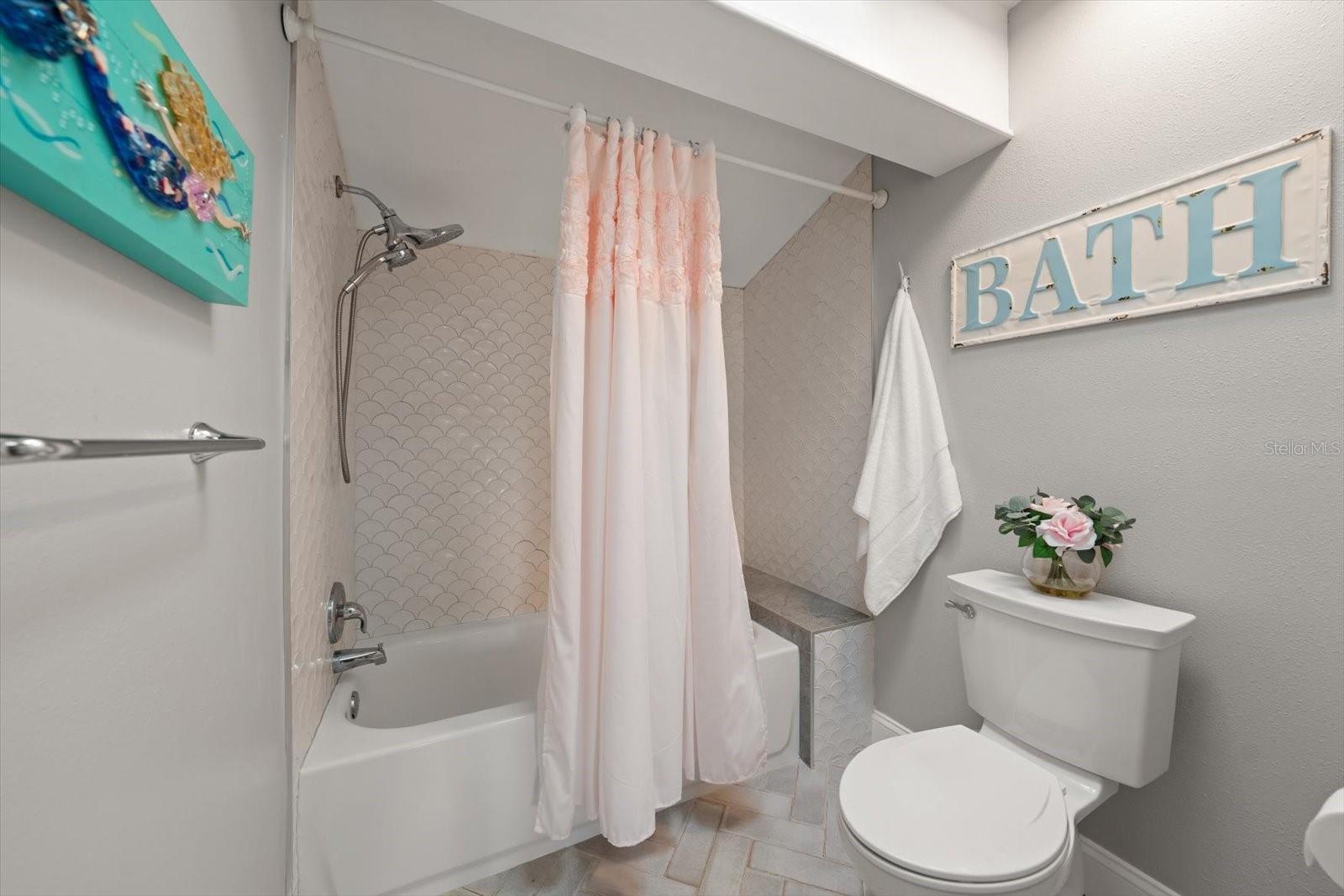 Ensuite bathroom with charming finishes.