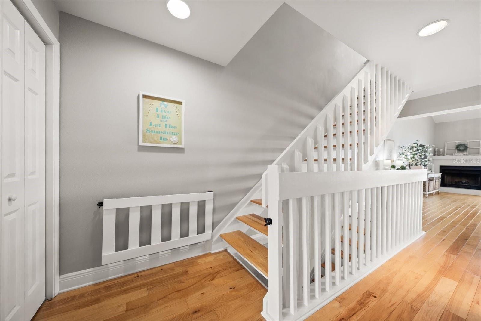 Gleaming hardwood flooring is found throughout.