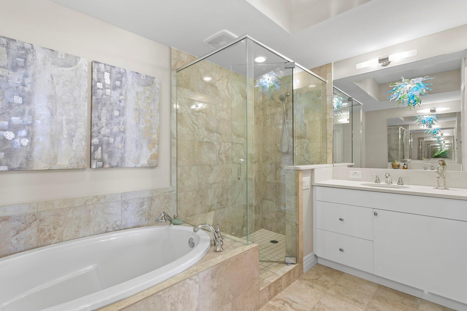 Primary Ensuite Bathroom features Dual Vanities and Jacuzzi Tub
