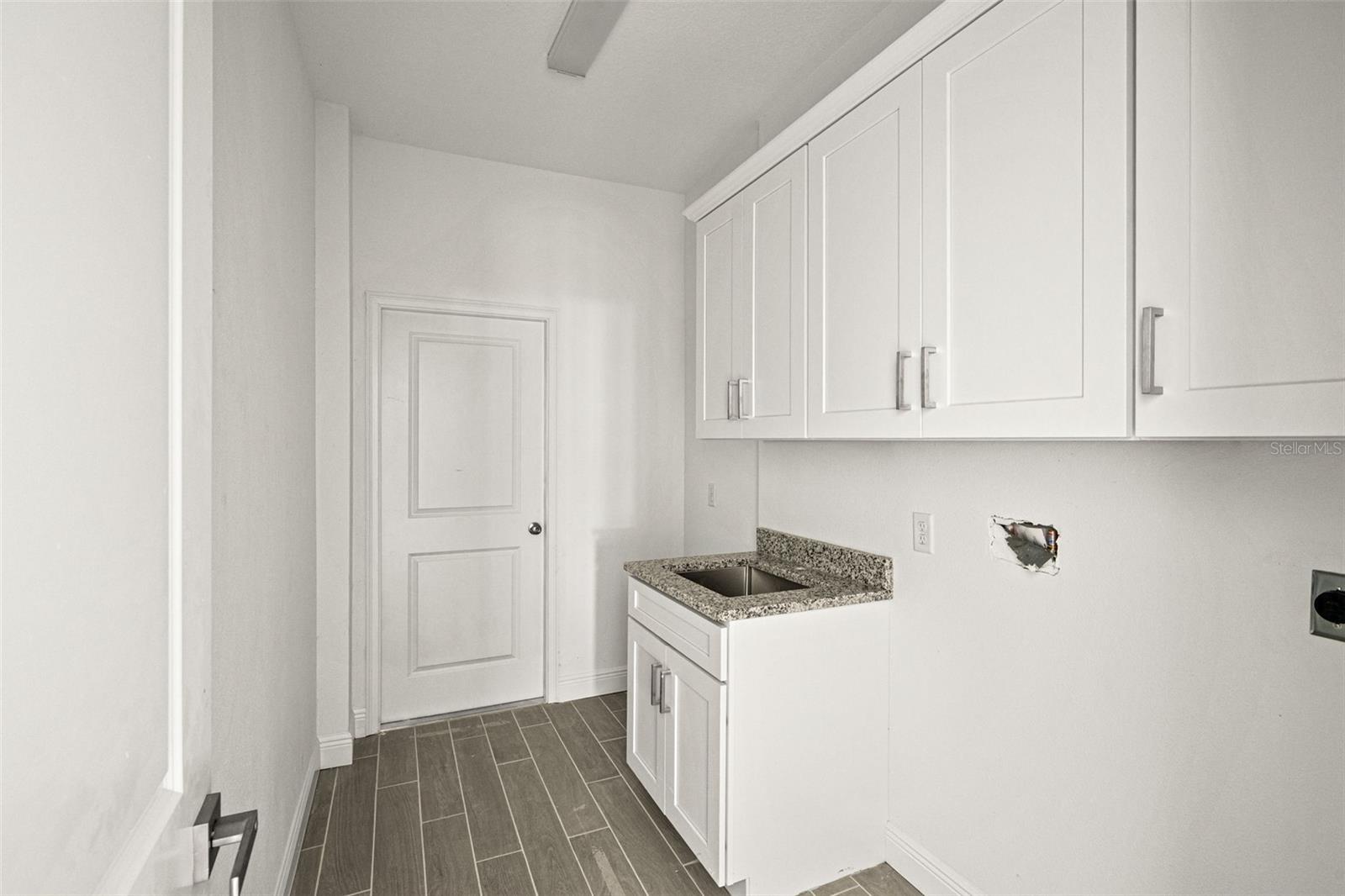 laundry room with utility sink