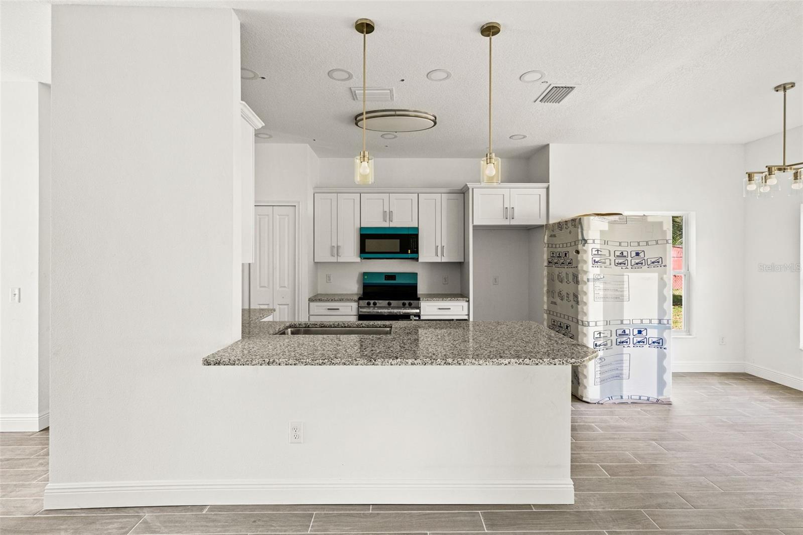 Kitchen with granite countertops and breakfast bar
