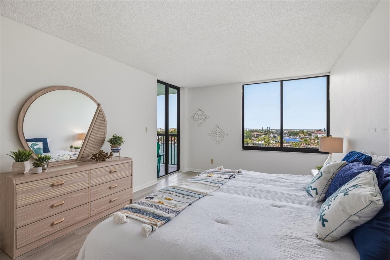 Primary bedroom with balcony access
