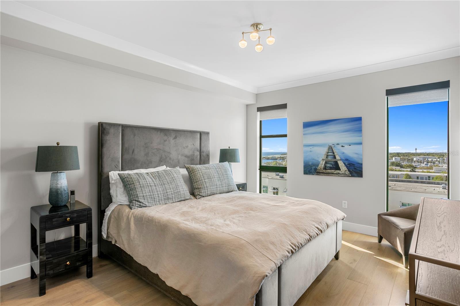 Spacious master bedroom and custom electric shades on all windows throughout.