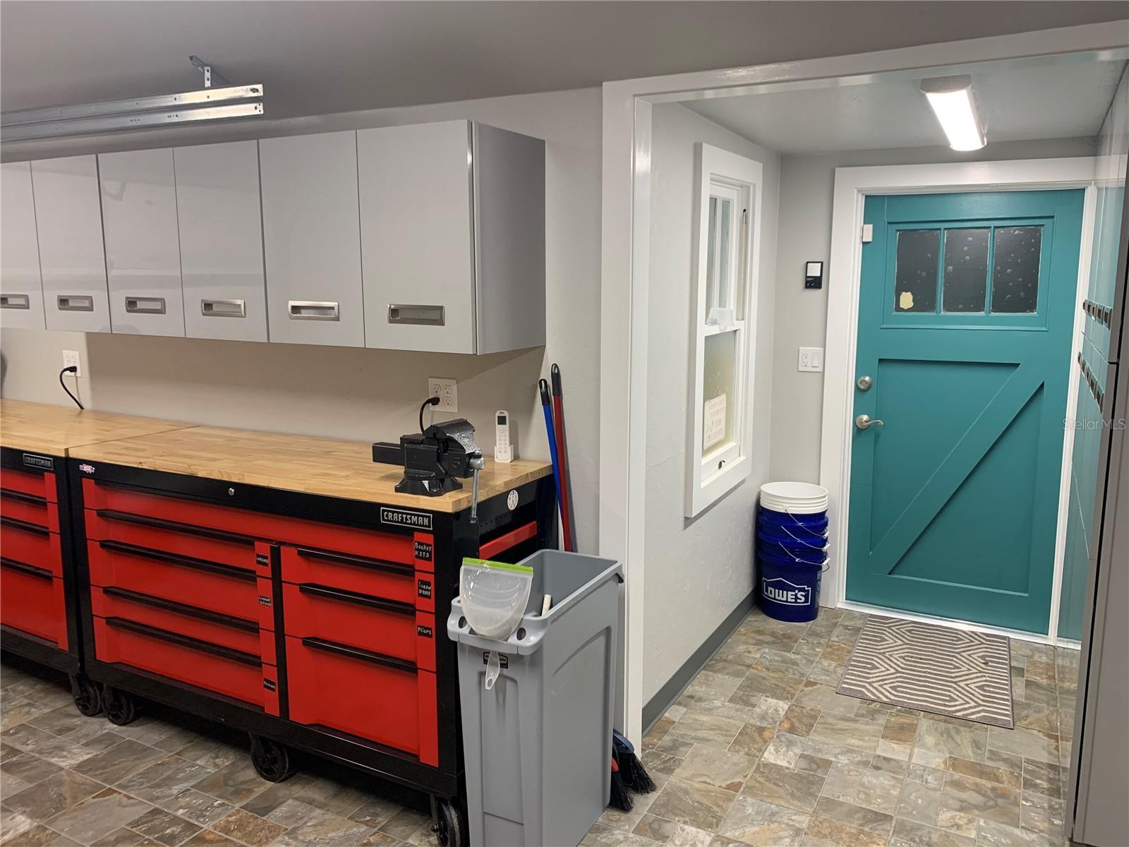 The garage has ceramic tile flooring and a climate controlled split a/c heat