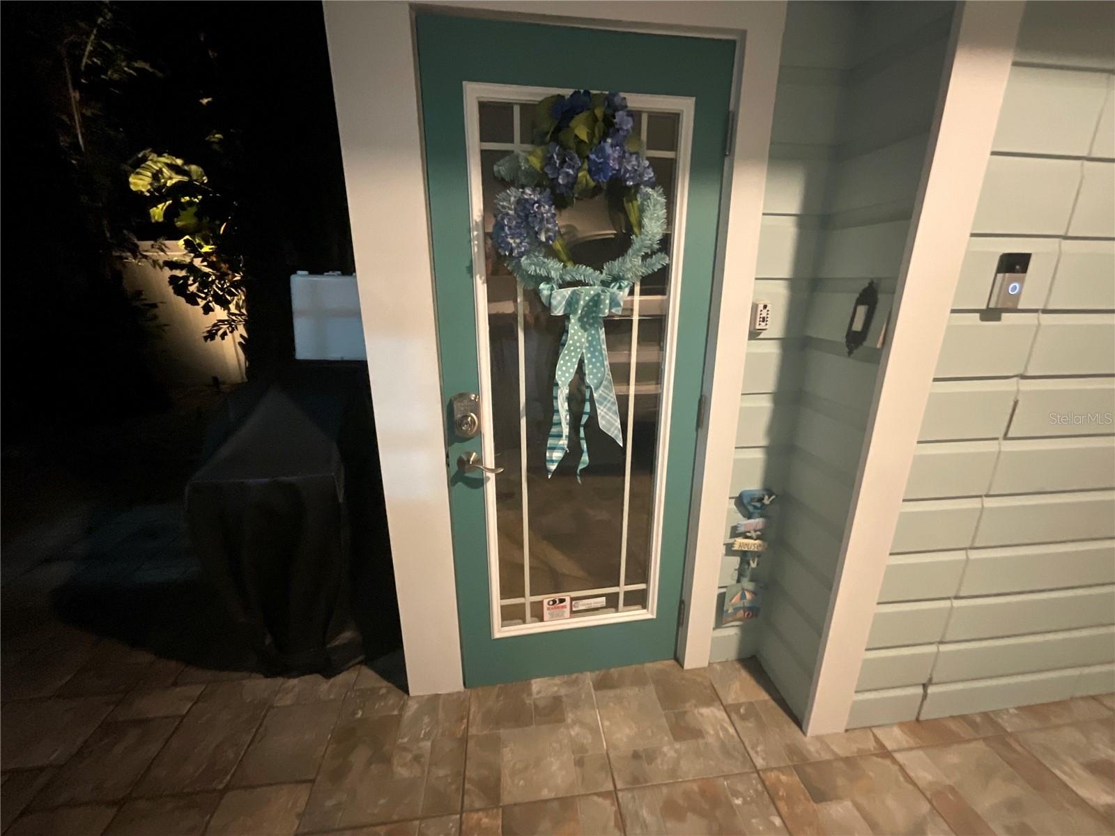 Entry to upstairs  apartment / kitchenette / secondary living quarters