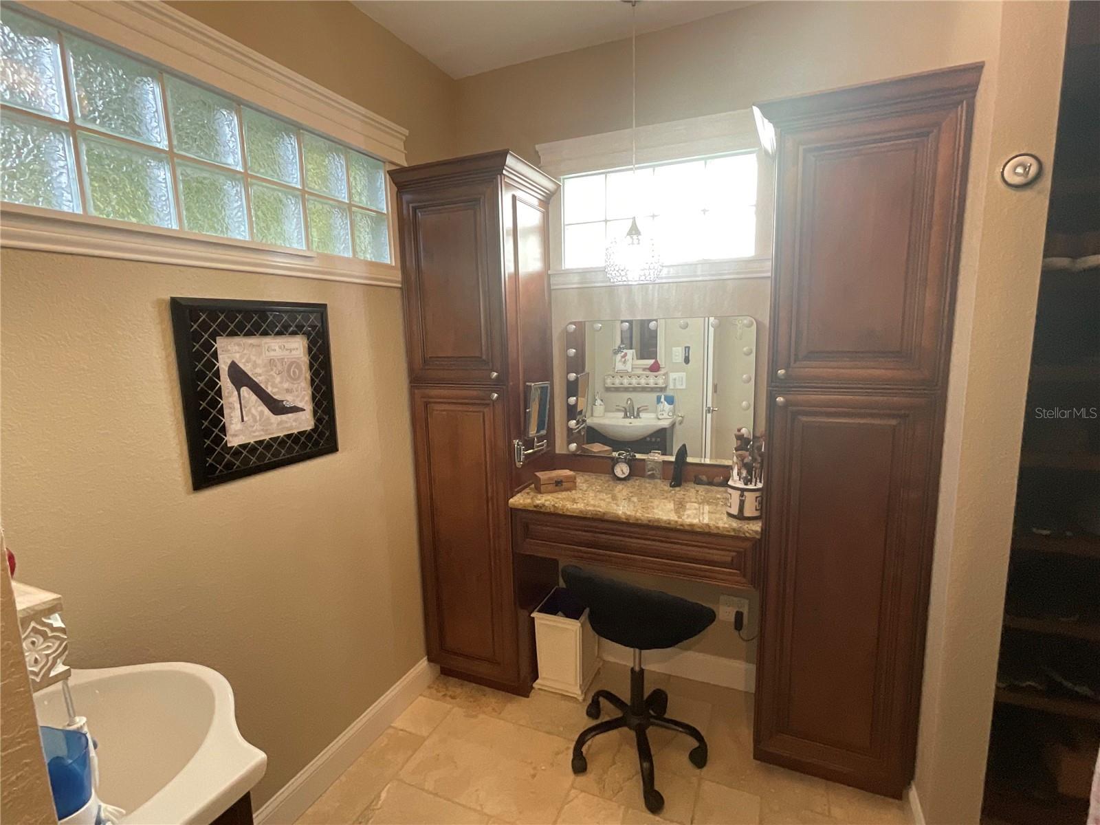 Custom cabinets on either side of the vanity, also 2nd sink in Primary bath
