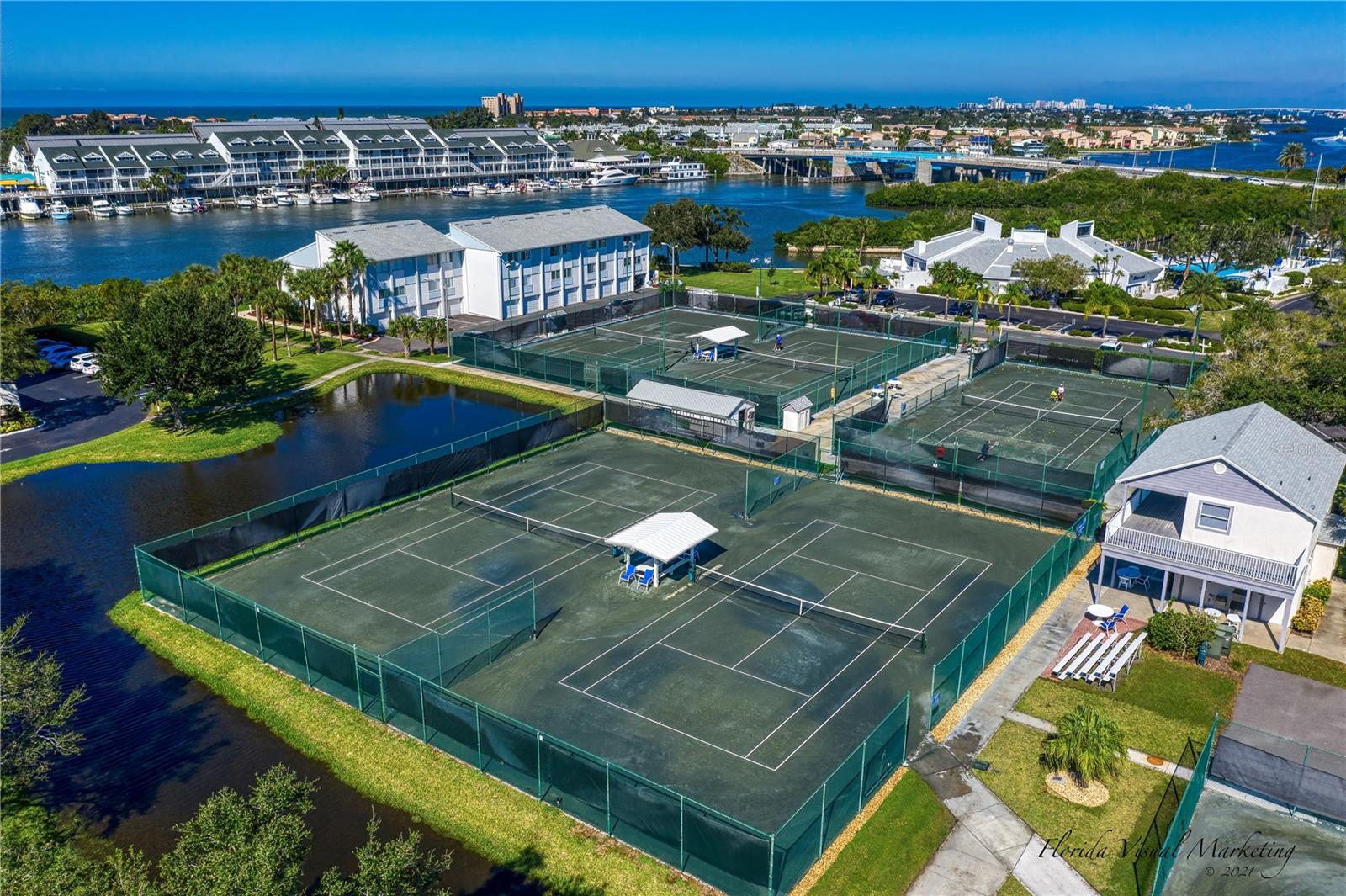 .. 11 Har Tru Clay Courts with Viewing Stands, Pro Shop and Massage Therapist. A Few Courts Have Been Re Designed For Pickle Ball.  The Complex Just Completed a Major Overhaul of the Clay Courts.