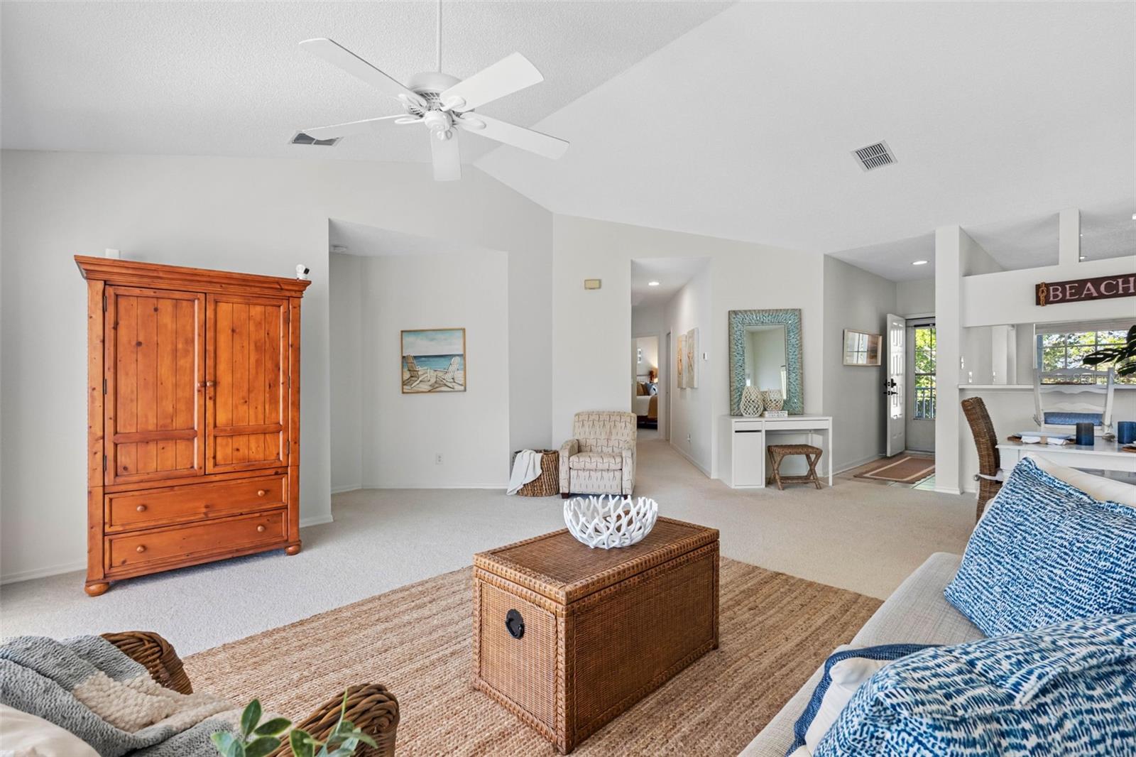 ... Living Room Area ... Guest Bedrooms, Bathroom #2 and Laundry Area Down Hallway just Left of Rectangle Blue Mirror.