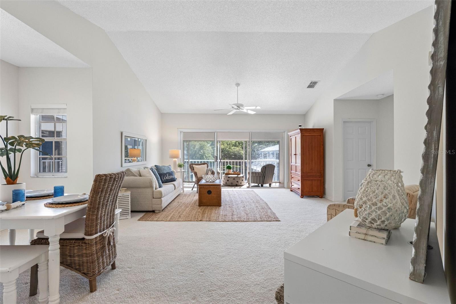.. Aesthetically Pleasing 10 foot Ceiling Heights - Corner Unit provides privacy & extra windows for natural light. Wide open floorplan.. With 1445 Sq Ft plus the Glass Enclosed Lanai - This Open Floorplan Layout is truly a Home..
