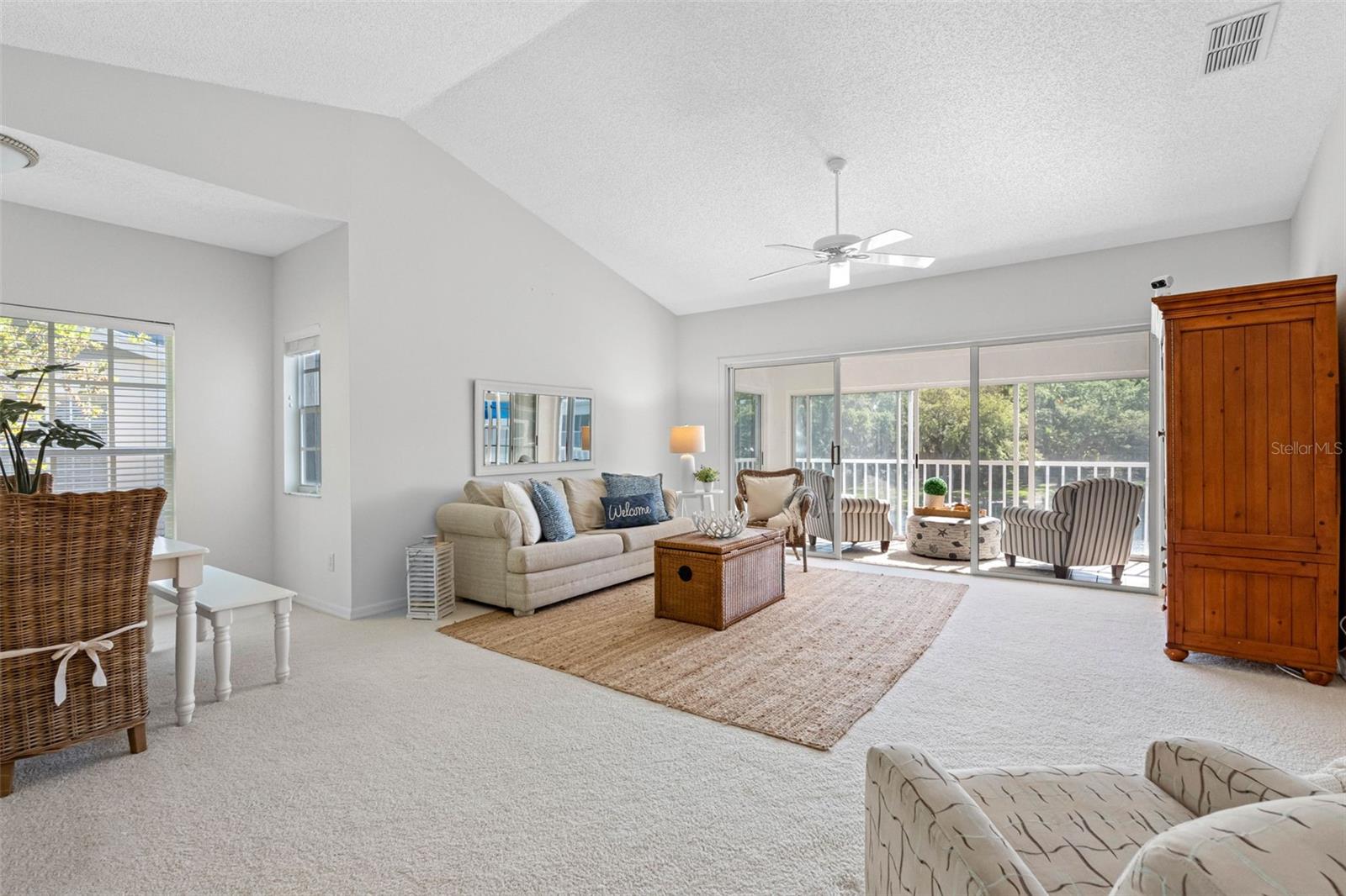 ..  10 Ft Cathedral Ceiling - An Abundance of Natural Light - Plus Great Water Views. I Forgot What Wall to Wall Carpeting Feels Like - It is Wonderful !  Off with the Shoes as the World Fades Away.