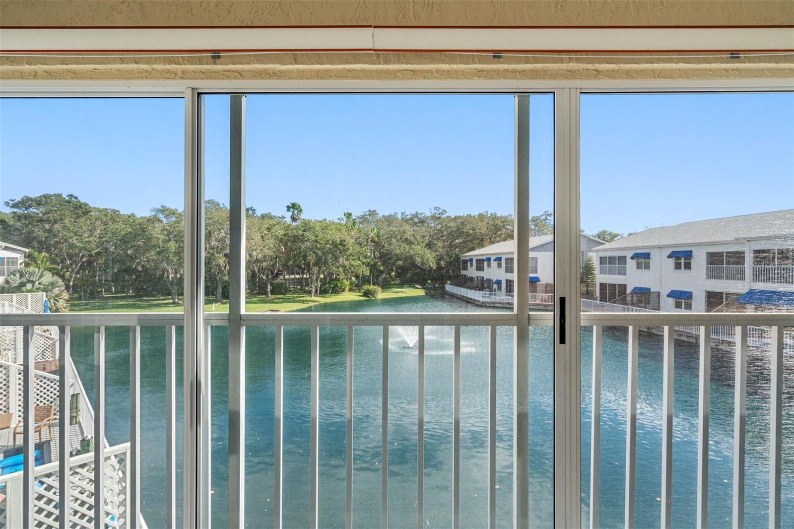 Gorgeous Water views from Glass Enclosed Lanai ... Balcony Faces Due East For Wonderful Morning Sun.. Both the Master Bedroom Suite and the Living Room are Fronted By the 16.3 X 7.9 Waterfront Lanai.
