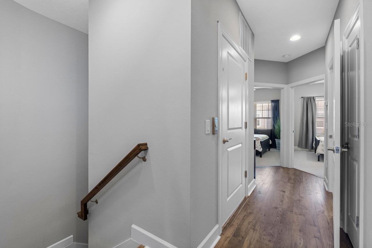 Elevator door and hall to 2nd and 3rd bedrooms