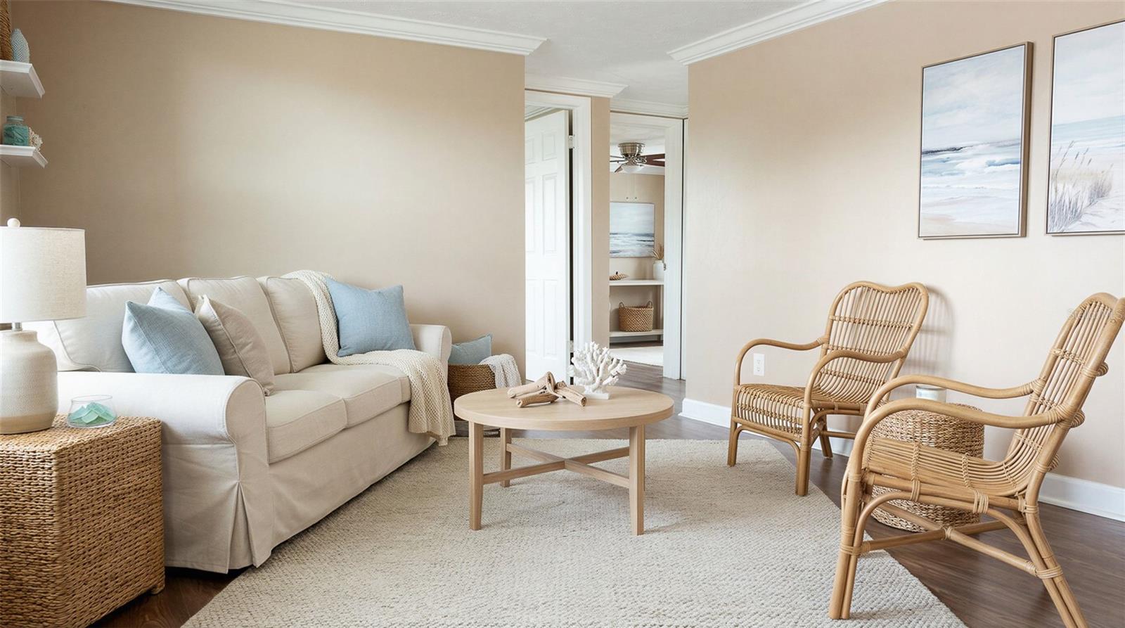 Bright and inviting living room filled with natural light from a large front window.