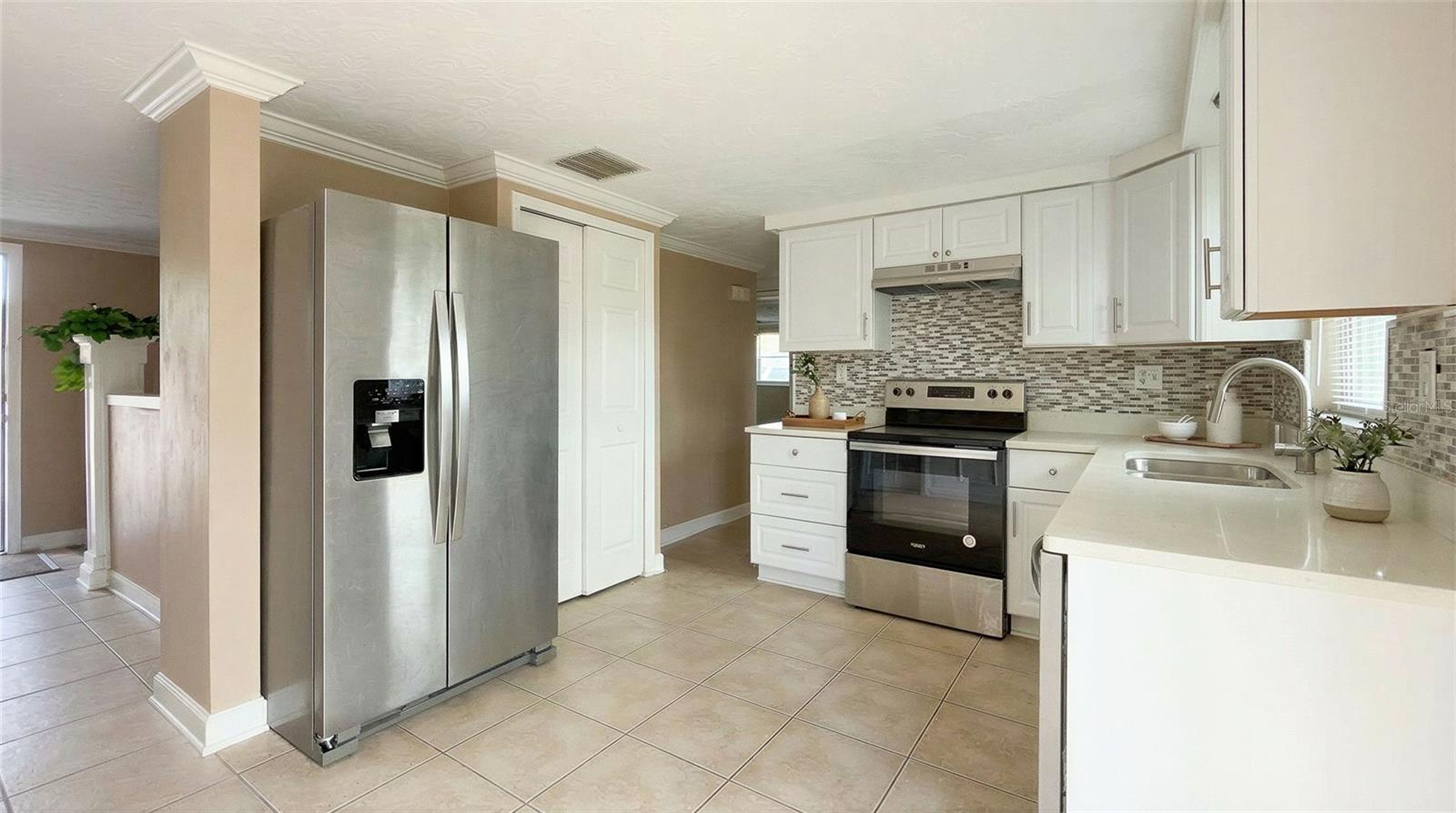 Imagine hosting friends and family in this bright dining space with backyard views.